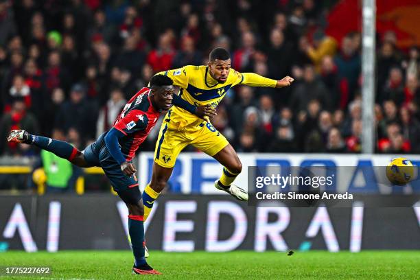 Caleb Ekuban of Genoa and Isak Hien of Hellas Verona vie for the ball during the Serie A TIM match between Genoa CFC and Hellas Verona FC at Stadio...