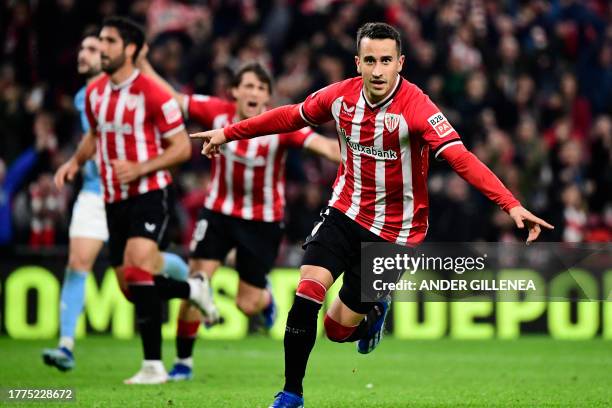 Athletic Bilbao's Spanish forward Alex Berenguer celebrates scoring his team's fourth goal during the Spanish league football match between Athletic...