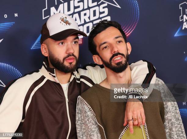 Olivio "Oli" Ordoñez and Florian "Bigflo" Ordoñez of Bigflo et Oli attend the 25th NRJ Music Awards on November 10, 2023 in Cannes, France.