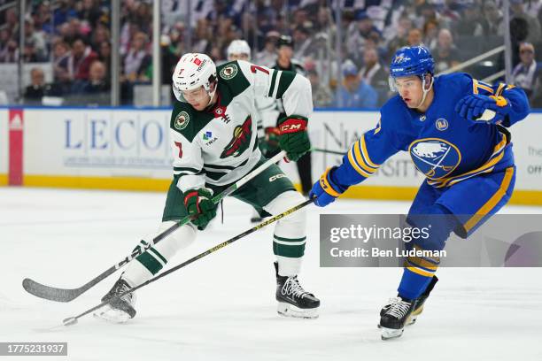 Peterka of the Buffalo Sabres defends against Brock Faber of the Minnesota Wild during an NHL game on November 10, 2023 at KeyBank Center in Buffalo,...