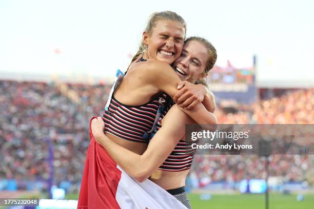 Alycia Butterworth of Team Canada celebrates with Kiana Gibson after competing in Women's 3000m Steeplechase at Estadio Nacional de Chile on Day 15...