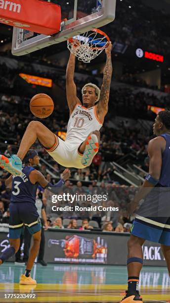 Jeremy Sochan of the San Antonio Spurs dunks against the Minnesota Timberwolves in the first half of an NBA In-Season Tournament at Frost Bank Center...