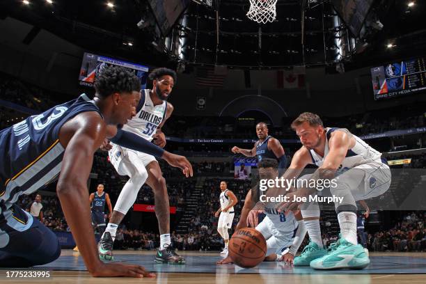 Luka Doncic, Josh Green, Derrick Jones Jr. #55 of the Dallas Mavericks and Jaren Jackson Jr. #13 of the Memphis Grizzlies go for loose ball on...