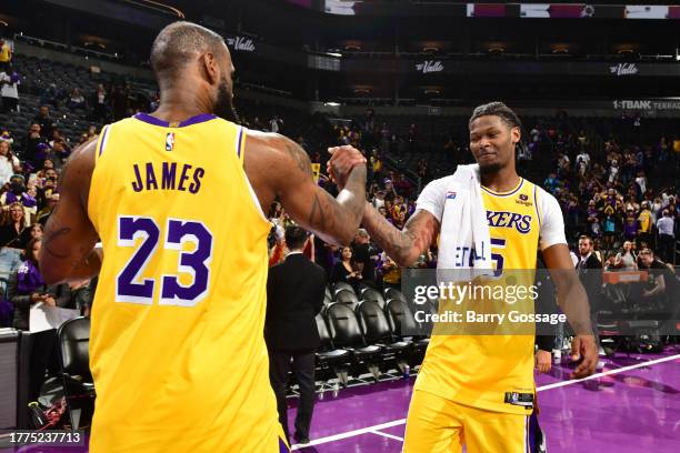 LeBron James high fives Cam Reddish of the Los Angeles Lakers after the game against the Phoenix Suns during the In-Season Tournament on November 10,...