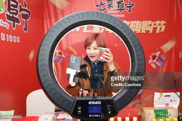 An anchor broadcasts a live video to promote goods in Yancheng city, Jiangsu province, China, Nov 11, 2023.