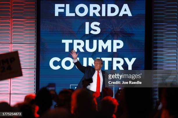 Republican presidential candidate former U.S. President Donald Trump greets the crowd during the Florida Freedom Summit at the Gaylord Palms Resort...