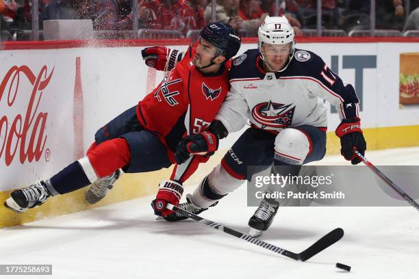 Justin Danforth of the Columbus Blue Jackets collides with Trevor van Riemsdyk of the Washington Capitals during the first period at Capital One...