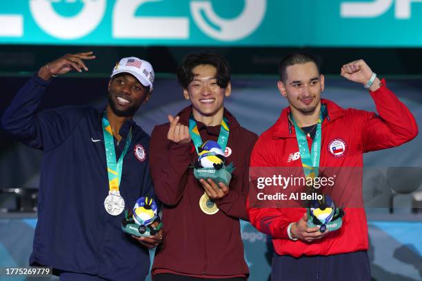 Silver medalist Jeffro of Team United States, Gold medalist Phil Wizard of Team Canada and Bronze medalist Matita of Team Chile pose on the podium...