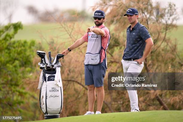 Will Gordon of the United States speaks with caddie on the 16th hole during the third round of the World Wide Technology Championship at El Cardonal...