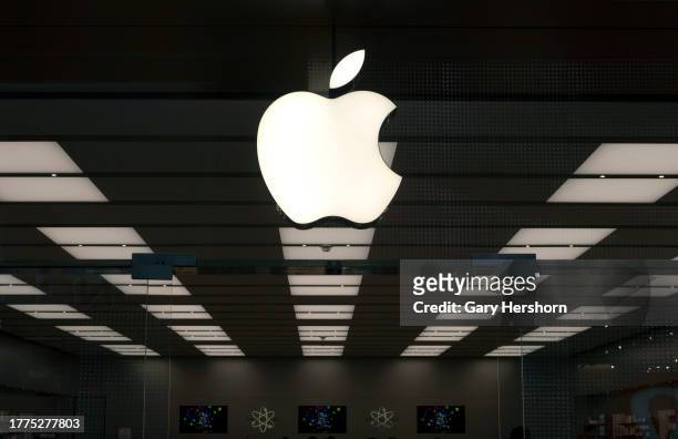An Apple corporate logo hangs above the front door of their store in the Garden State Plaza Mall on November 4 in Paramus, New Jersey