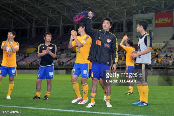 Vegalta Sendai players applaud fans after the team's 2-0 victory in the J.League J1 1st stage match between Vegalta Sendai and Nagoya Grampus at...