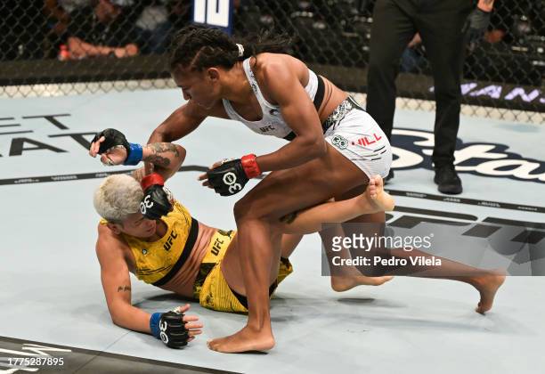 Angela Hill punches Denise Gomes of Brazil in a strawweight fight during the UFC Fight Night event at Ibirapuera Gymnasium on November 04, 2023 in...