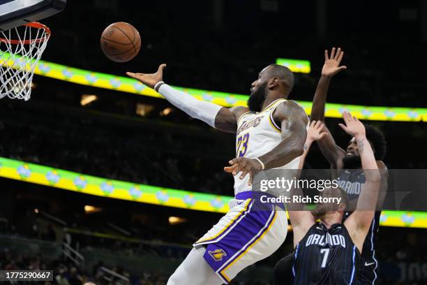 LeBron James of the Los Angeles Lakers shoots the ball over Joe Ingles of the Orlando Magic during the second quarter at Amway Center on November 04,...