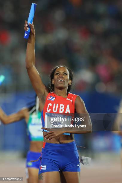 Lisneidy Veitia of Team Cuba crosses the finish line in Women's 4 x 400m Relay at Estadio Nacional de Chile on Day 15 of Santiago 2023 Pan Am Games...
