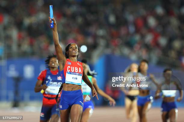 Lisneidy Veitia of Team Cuba crosses the finish line in Women's 4 x 400m Relay at Estadio Nacional de Chile on Day 15 of Santiago 2023 Pan Am Games...