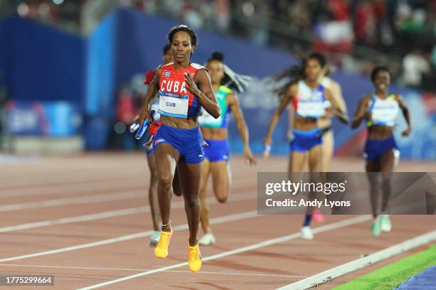 Lisneidy Veitia of Team Cuba crosses the finish line in Women's 4 x 400m Relay at Estadio Nacional de Chile on Day 15 of Santiago 2023 Pan Am Games...