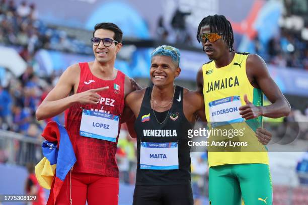 Jesus Lopez of Team Mexico, Jose Antonio Maita of Team Venezuela and Navasky Anderson of Team Jamaica after competing in Men's 800m Final at Estadio...
