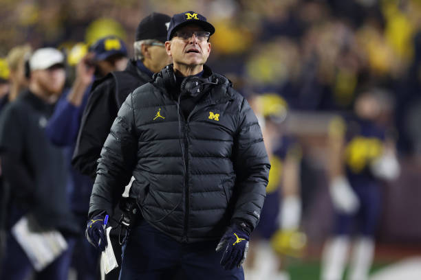 Head coach Jim Harbaugh of the Michigan Wolverines looks on in the first half while playing the Purdue Boilermakers at Michigan Stadium on November...