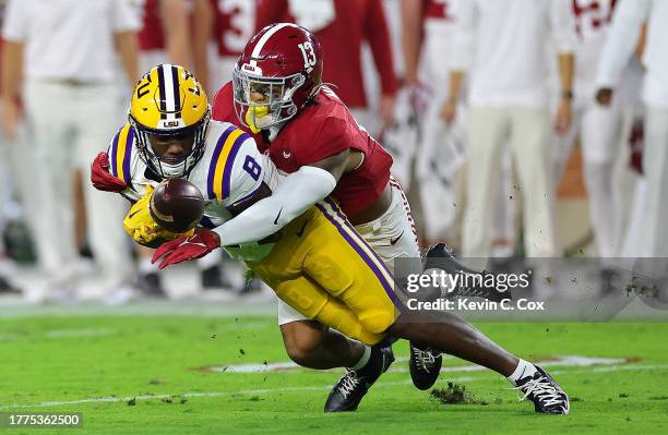 Malachi Moore of the Alabama Crimson Tide breaks up this pass intended for Malik Nabers of the LSU Tigers during the first quarter at Bryant-Denny...