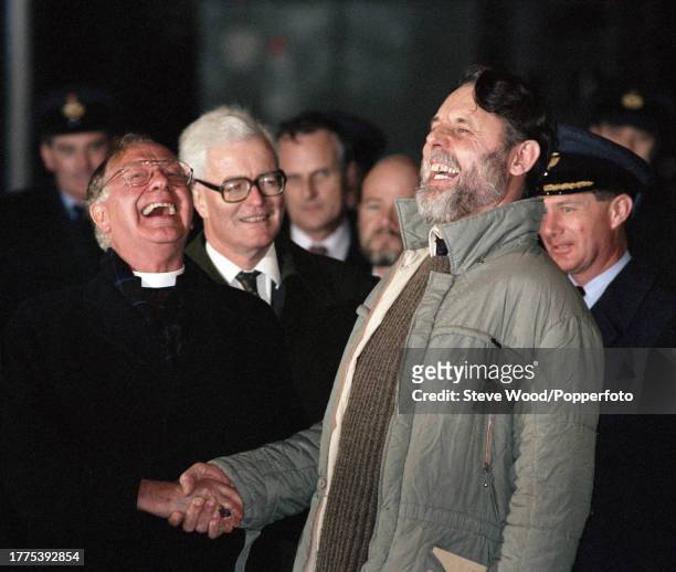 British humanitarian and author Terry Waite is welcomed home by the former Archbishop of Canterbury, Lord Robert Runcie after returning to England...