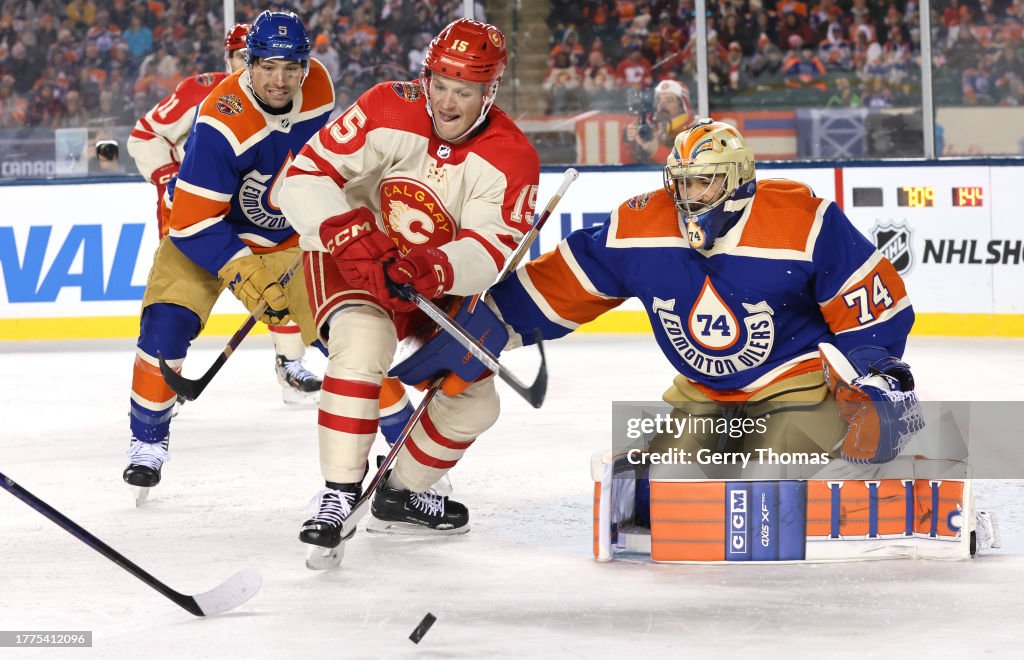 Edmonton Tim Dryden Hunt of the Calgary Flames looks to play the puck in front of ...
