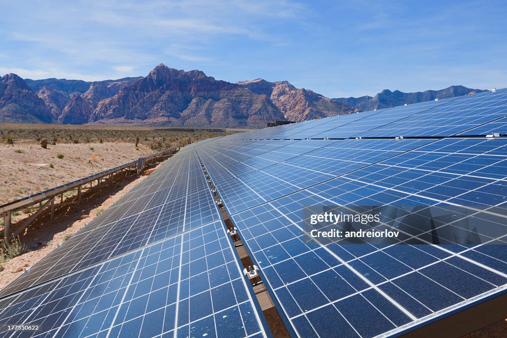 Tilted solar panels, near the mountains of the Mojave Desert