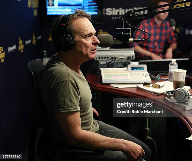 Singer David Lee Roth guest hosts 'The Opie & Anthony Show' at SiriusXM Studios on August 23, 2013 in New York City.