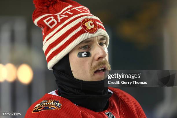Greer of the Calgary Flames looks on before a team photo before practice at Commonwealth Stadium on October 28, 2023 in Edmonton, Alberta.