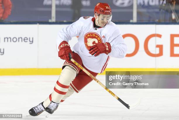 Mikael Backlund of the Calgary Flames skates during practice at Commonwealth Stadium on October 28, 2023 in Edmonton, Alberta.