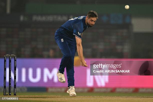 England's Chris Woakes bowls during the 2023 ICC Men's Cricket World Cup one-day international match between England and Pakistan at the Eden Gardens...