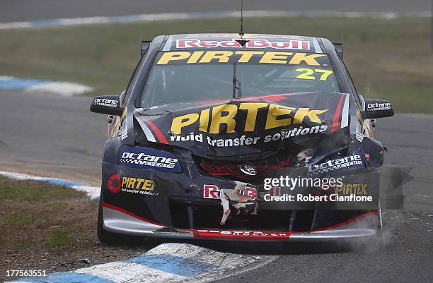 Casey Stoner driver of the Red Bull Pirtek Holden comes to a stop after crashing out at the start of race five of the Dunlop Development Series at...