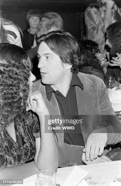 Diahnne Abbott and Robert De Niro attend an awards ceremony at Sardi's in New York City on January 30, 1977.