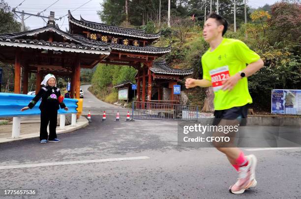 Participants run during the 2023 Guizhou Ring Leigong Mountain Marathon in Leishan county, Qiandongnan, Guizhou Province, China, Nov 11, 2023.