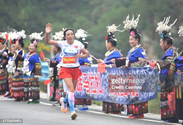 Participants run during the 2023 Guizhou Ring Leigong Mountain Marathon in Leishan county, Qiandongnan, Guizhou Province, China, Nov 11, 2023.