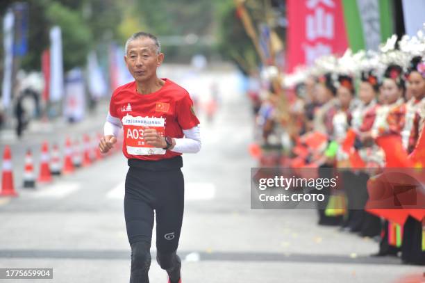 Participants run during the 2023 Guizhou Ring Leigong Mountain Marathon in Leishan county, Qiandongnan, Guizhou Province, China, Nov 11, 2023.