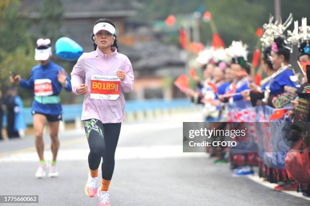 Participants run during the 2023 Guizhou Ring Leigong Mountain Marathon in Leishan county, Qiandongnan, Guizhou Province, China, Nov 11, 2023.