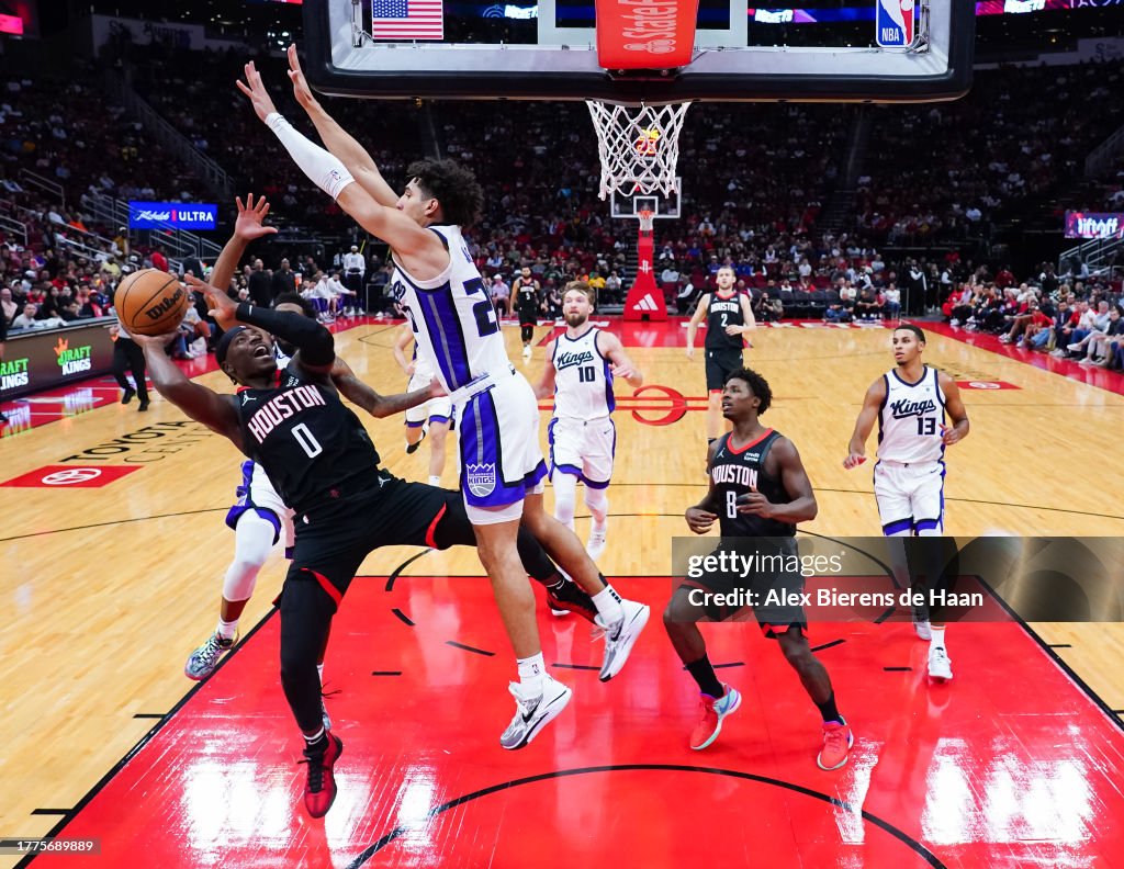Jones Houston Rockets Aaron Holiday of the Houston Rockets attempts the shot as Colby Jones ...
