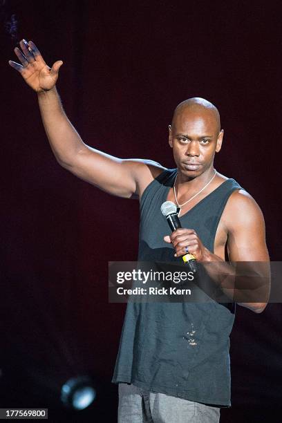 Comedian Dave Chappelle performs on stage during the tour opener in support of the Oddball Comedy & Curiosity Festival at Austin360 Amphitheater on...