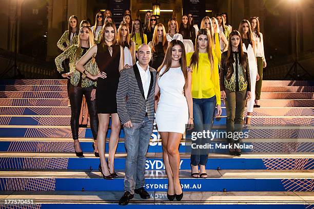 Designer Bruno Schiavi poses with models on the steps of Sydney City Town Hall backstage after the Kardashian Kollection show during Mercedes-Benz...