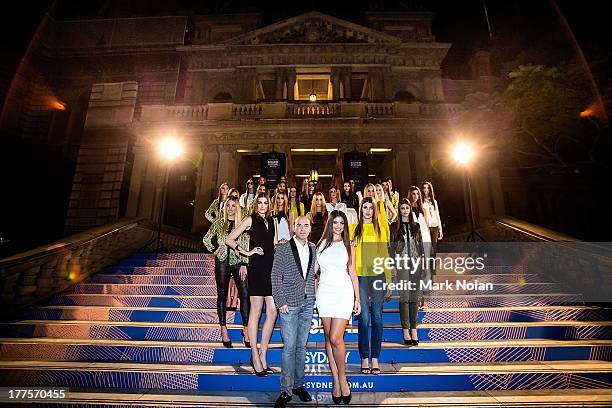 Designer Bruno Schiavi poses with models on the steps of Sydney City Town Hall backstage after the Kardashian Kollection show during Mercedes-Benz...