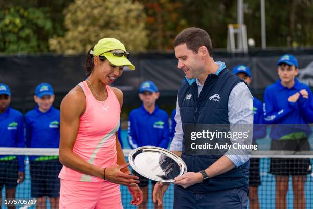 Astra Sharma of Australia accepts the runners-up trophy from Tennis Australia CEO Darren Simpson during the Women's Final match against Destanee...