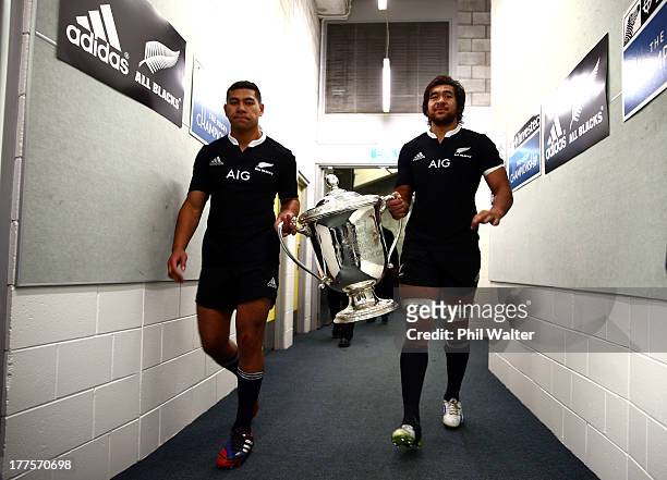 Charles Piutau and Steven Luatua walk into the sheds with the Bledisloe Cup following The Rugby Championship Bledisloe Cup match between the New...