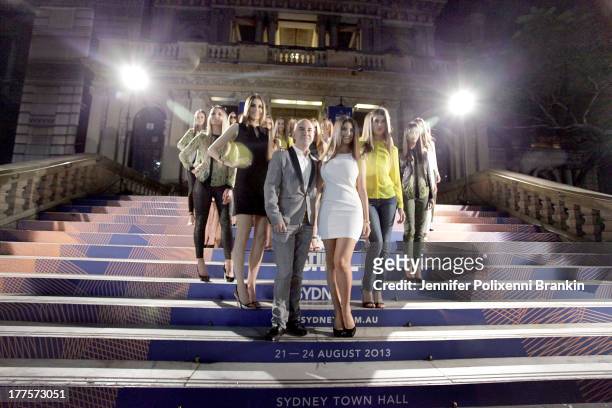 Designer Bruno Schiavi poses with models on the steps of the front of Sydney Town Hall at the Kardashian Kollection show during Mercedes-Benz Fashion...
