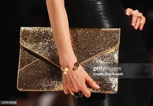 Model showcases designs on the runway at the Kardashian Kollection show during Mercedes-Benz Fashion Festival Sydney 2013 at Sydney Town Hall on...