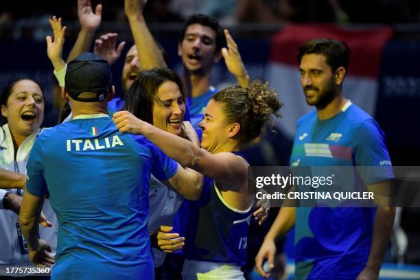 Italy's Jasmine Paolini celebrates with Italy's coach Tathiana Garbin after winning the semifinal singles tennis match against Slovenia's Tamara...