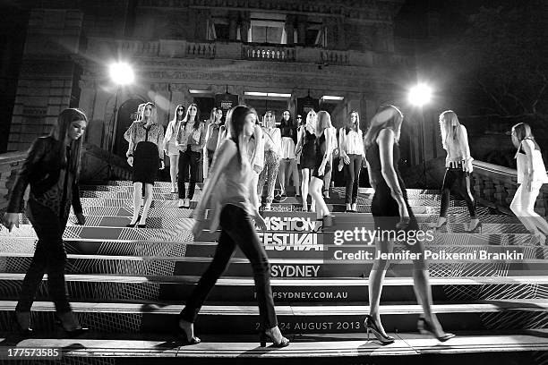 Models showcase designs by the Kardashian Kollection show during Mercedes-Benz Fashion Festival Sydney 2013 at Sydney Town Hall on August 24, 2013 in...