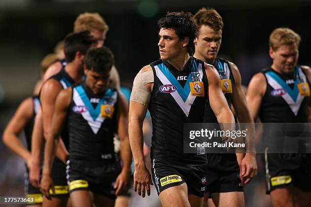 Angus Monfries of the Power looks on while walking from the field at the half time break during the round 22 AFL match between the Fremantle Dockers...