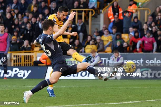 Wolverhampton Wanderers' Spanish midfielder Pablo Sarabia shoots to score their first goal during the English Premier League football match between...