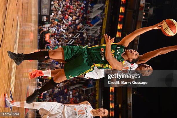 Tanisha Wright of the Seattle Storm shoots against Charde Houston of the Phoenix Mercury on August 23, 2013 at U.S. Airways Center in Phoenix,...