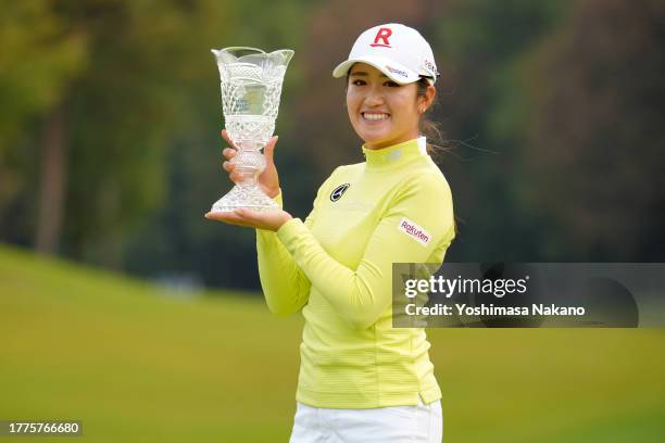 Mone Inami of Japan poses with the trophy after winning the tournament following the final round of the TOTO Japan Classic at the Taiheiyo Club's...